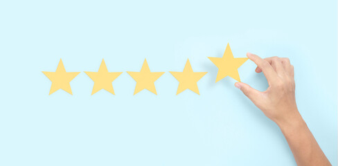 Hand of touching rise on increasing five stars. Increase rating evaluation