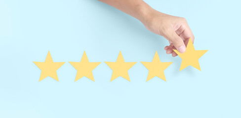 Hand of touching rise on increasing five stars. Increase rating evaluation