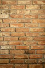 Brick wall. The wall is made of red, old bricks. Vintage background.
