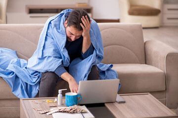 Young man feeling bad at home