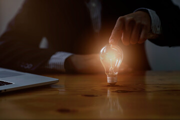 Close-up Of female lawyer working in office businessman holding light bulb. Legal law, advice and...
