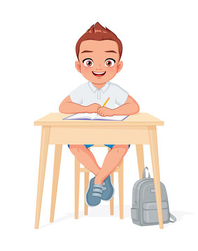Happy school boy sitting at desk. Cartoon vector illustration.
