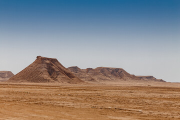Sandstone rocks on the horizon of the Sahara desert of Tunisia