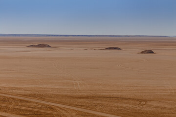 Sandstone rocks on the horizon of the Sahara desert of Tunisia