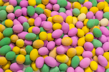 Group of colorful peanuts in glaze.