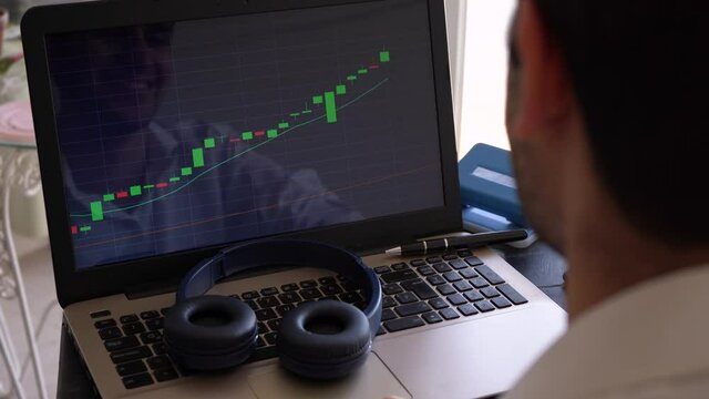 Bullish Candlestick Chart On Laptop Computer - Happy Man Clap While Looking At Financial Stock Market Bar Chart Going Up. - close up