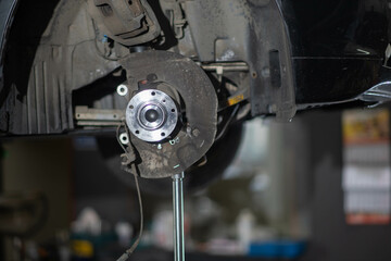 car wheel hub replacement in garage