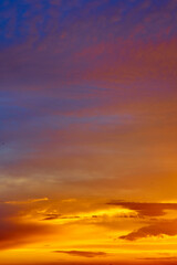 Fototapeta premium Phantasmagorical vivid colorful cloudscape at sunset time. Abstract nature background.