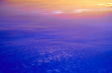 Fototapeta premium Phantasmagorical vivid colorful cloudscape at sunset time. Abstract nature background.