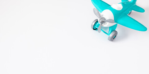 Model plane. Airplane mockup toy on white background. Travel vacation concept. Flat lay, top view, copy space