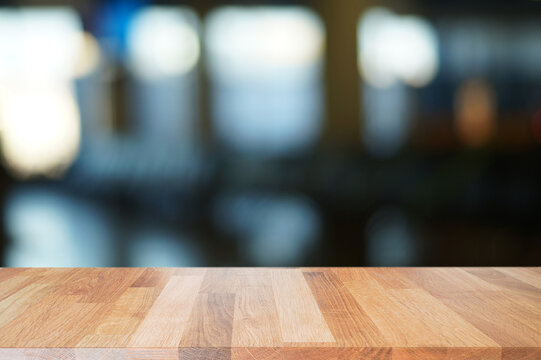 Wooden top with blurred lobby background can be used for mocking up or display product to make advertising.                 