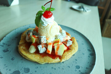 naan or roti, deep fried naan with fruit and ice cream topping