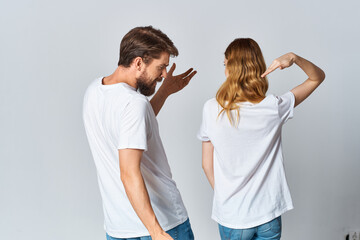 man and woman in white t-shirts and jeans design casual clothing mockup