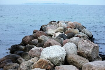 Breakwater, stones at the sea