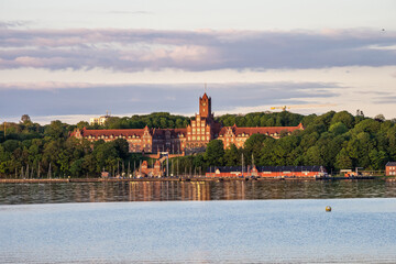 Fototapeta premium The historic building of Marine School in Flensburg at sunset. Schleswig-Holstein in Germany