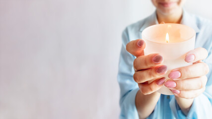 Hands are holding a candle. copy space, candle in hand. Christianity, Christian prayer.