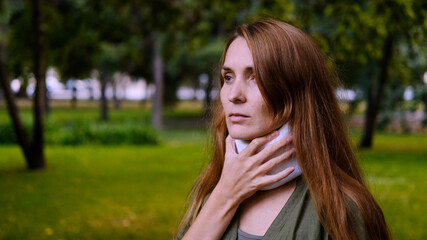 Naklejka premium Rotary subluxation atlanta, a woman wears a cervical collar from injury, neck stretching, muscle pain, concussion, sprain of the ligaments, displacement of the vertebrae