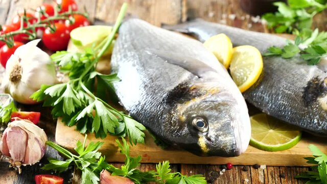 raw dorado on board with ingredients