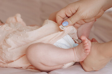 Mother holding baby feet