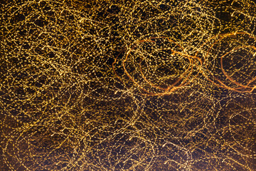 Round circle yellow stripes texture. Night light painting background