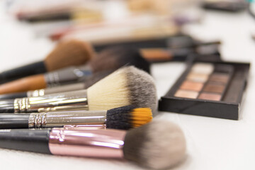 Make up the most necessary things. A set of brushes and professional cosmetics on the makeup...
