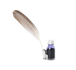 Feather pen and bottle of ink on white background