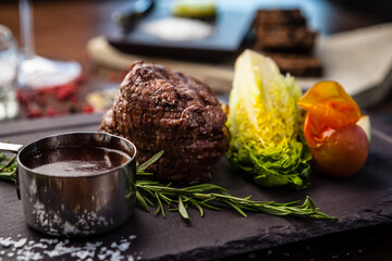 Black Angus Chateaubriant steak. Tenderloin from Brazil. Delicious healthy traditional food closeup served for lunch in modern gourmet cuisine restaurant