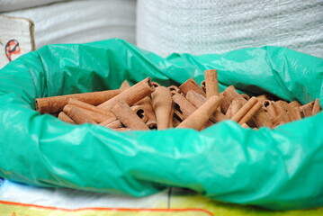 Dried bark strips of Cinnamon in a plastic sack at the spice market. This  spice obtained from the inner bark of several tree species from the genus Cinnamonum