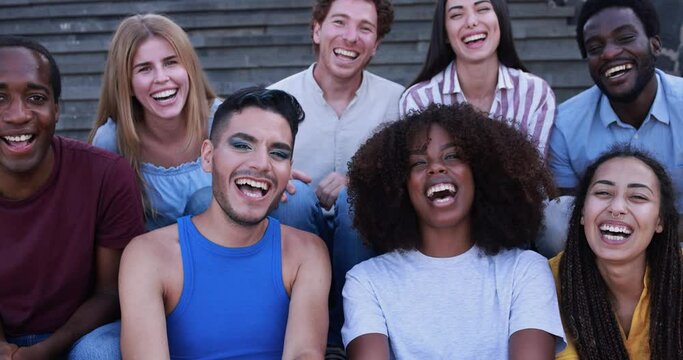 Young diverse people having fun outdoor laughing together - Diversity concept