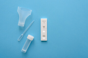 Covid19 antigen test kit with cassette, pipette and plastic bottle for saliva - obrazy, fototapety, plakaty