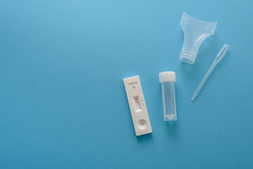 Covid19 antigen test kit with cassette, pipette and plastic bottle for saliva. Negative result