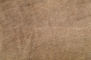 fabric grunge background, real cotton denim brown, wrinkled, frayed, close