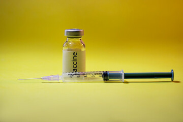 Coronavirus Covid-19 vaccine with syringe isolated on Dark background