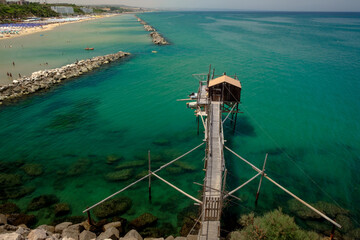 The amazing adriatic sea with fishing trebuchet on the beach of Termoli , Molise , Italy
