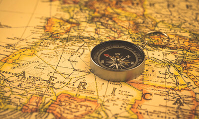 Antique compass on vintage africa travel map, exploration and navigation concept background photo