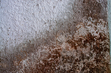 Old fading plaster wall texture, lack of maintenance, vintage background
