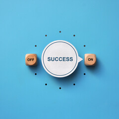 A switch with the inscription: Success and on and off icons. A person achieves success