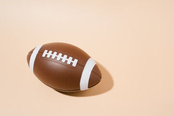 american football on brown background. sport and competition. copy space. 3d illustration