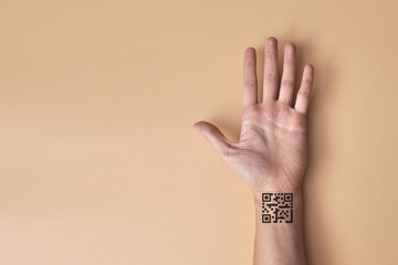 a QR code in the form of a tattoo on a person's arm. A symbol of control over people with the help...