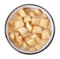 Tasty corn pads with milk in bowl isolated on white, top view