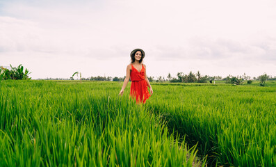 Optimistic woman walking through path