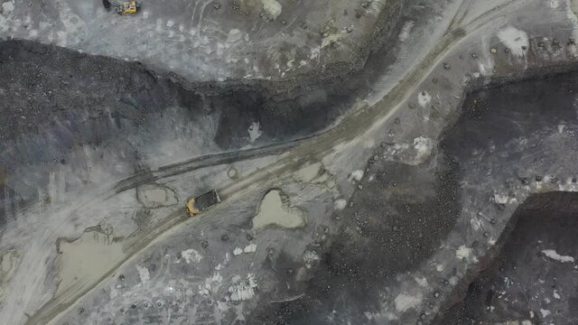 Coal mining an open pit extractive industry, top view aerial