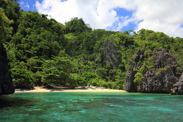 Fototapeta na wymiar View of a pristine beach from a boat in the Philippines