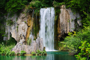 Obraz na płótnie Canvas Beautiful splashes of water and trekking trail on waterfalls of Croatia national park