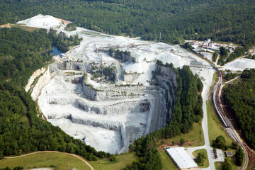 Aerial view of salt mine rock quarry factory in forest