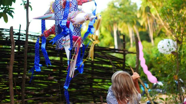 7 year old girl breaks a holiday pinata