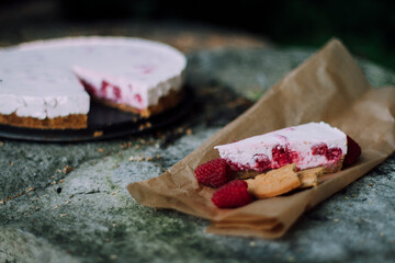 homemade raspberry cheesecake on parchment paper