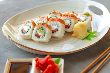 Japanese sushi roll with salmon on plate