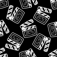 vector seamless pattern of doodles with a firecracker from the movie. a hand-drawn clapperboard pattern for a movie, an isolated white outline randomly placed on a black background for a retro movie d
