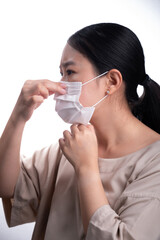 Asian woman is wearing mask on her face against coronavirus or COVID-19 disease. The Pollution Healthcare and virus pandemic concept.